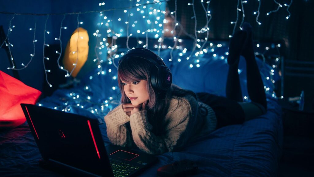 Woman browsing top casinos at Nightrush late at night on her laptop
